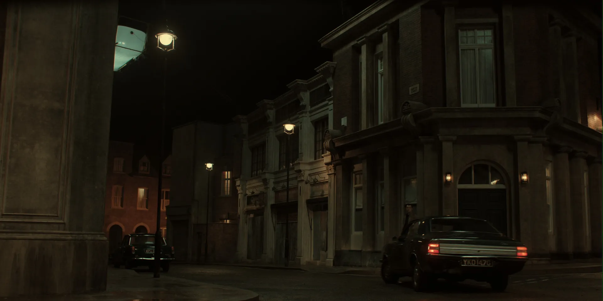 Original plate: a backlot street at night with a lighting rig and blank walls.